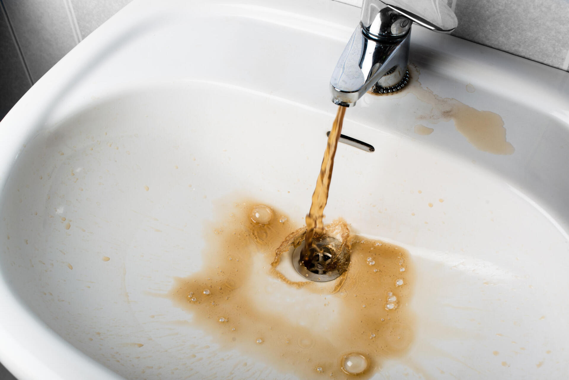 Water that is yellow-red in color coming out of faucet